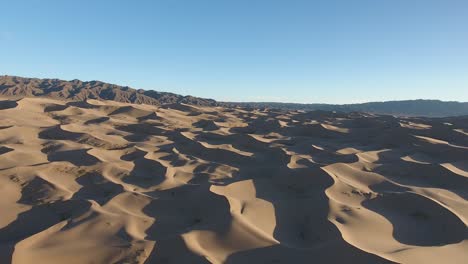 Aerial-drone-panorama-of-sand-dunes-in-gobi-desert-mongolia-during-sunset